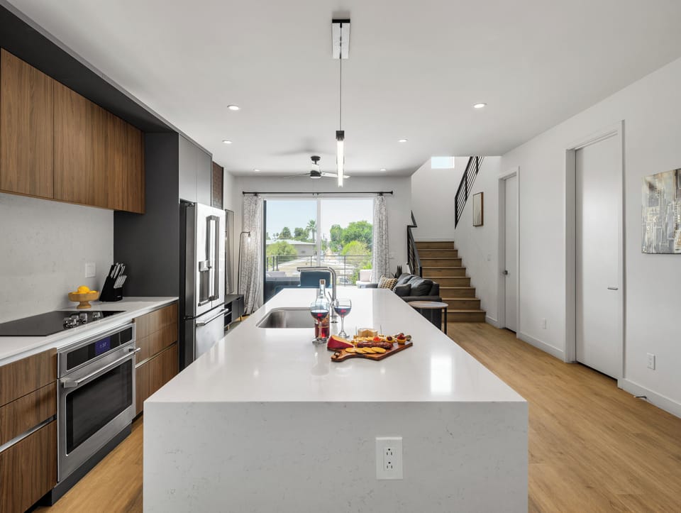 1st Floor: Fully equipped modern kitchen completely stocked with all culinary essentials and includes high-end Cafe stainless steel appliances.