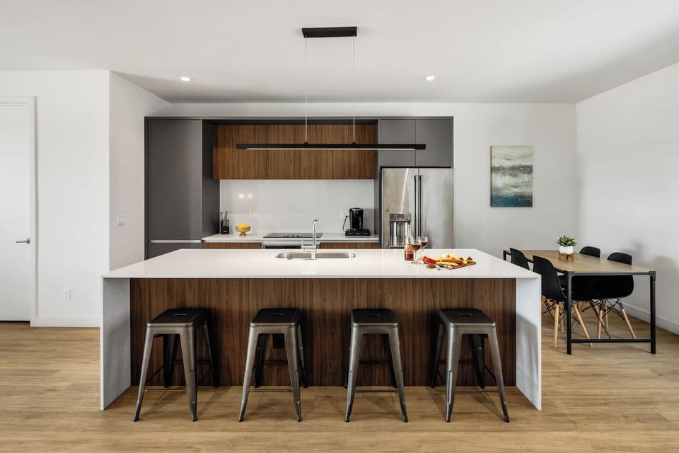 1st Floor: Fully equipped modern kitchen completely stocked with all culinary essentials and includes high-end Cafe stainless steel appliances.
