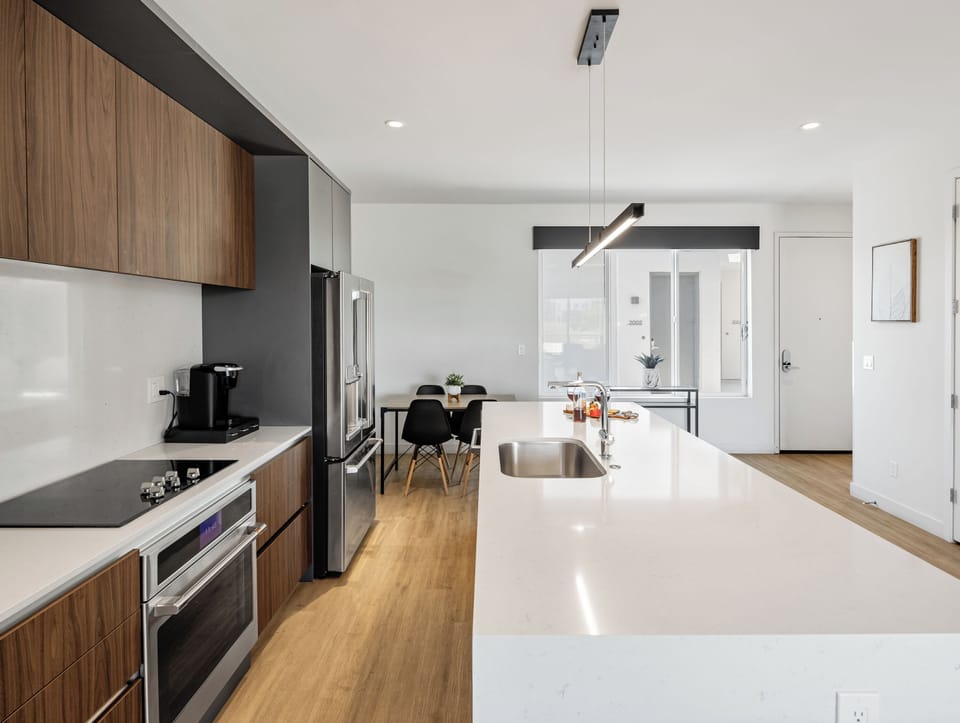 1st Floor: Fully equipped modern kitchen completely stocked with all culinary essentials and includes high-end Cafe stainless steel appliances.
