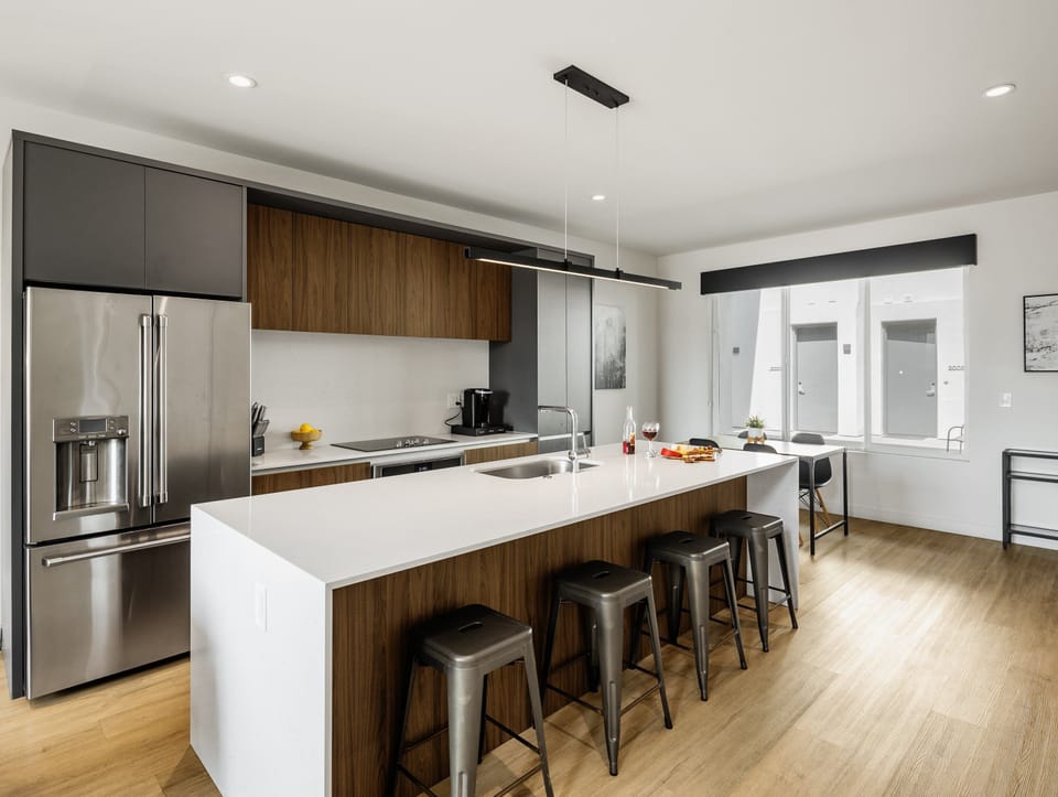 1st Floor: Fully equipped modern kitchen completely stocked with all culinary essentials and includes high-end Cafe stainless steel appliances.