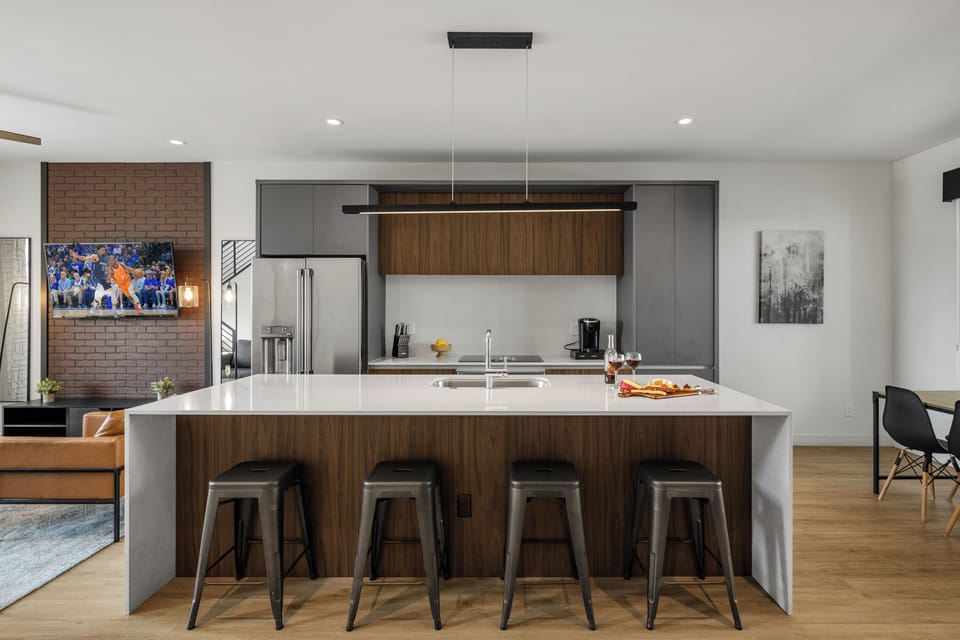 1st Floor: Fully equipped modern kitchen completely stocked with all culinary essentials and includes high-end Cafe stainless steel appliances.