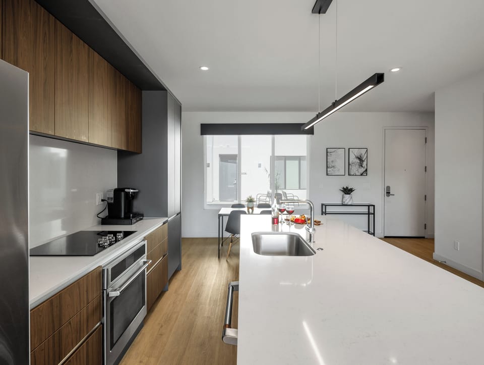 1st Floor: Fully equipped modern kitchen completely stocked with all culinary essentials and includes high-end Cafe stainless steel appliances.