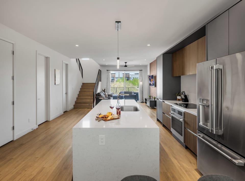 1st Floor: Fully equipped modern kitchen completely stocked with all culinary essentials and includes high-end Cafe stainless steel appliances.