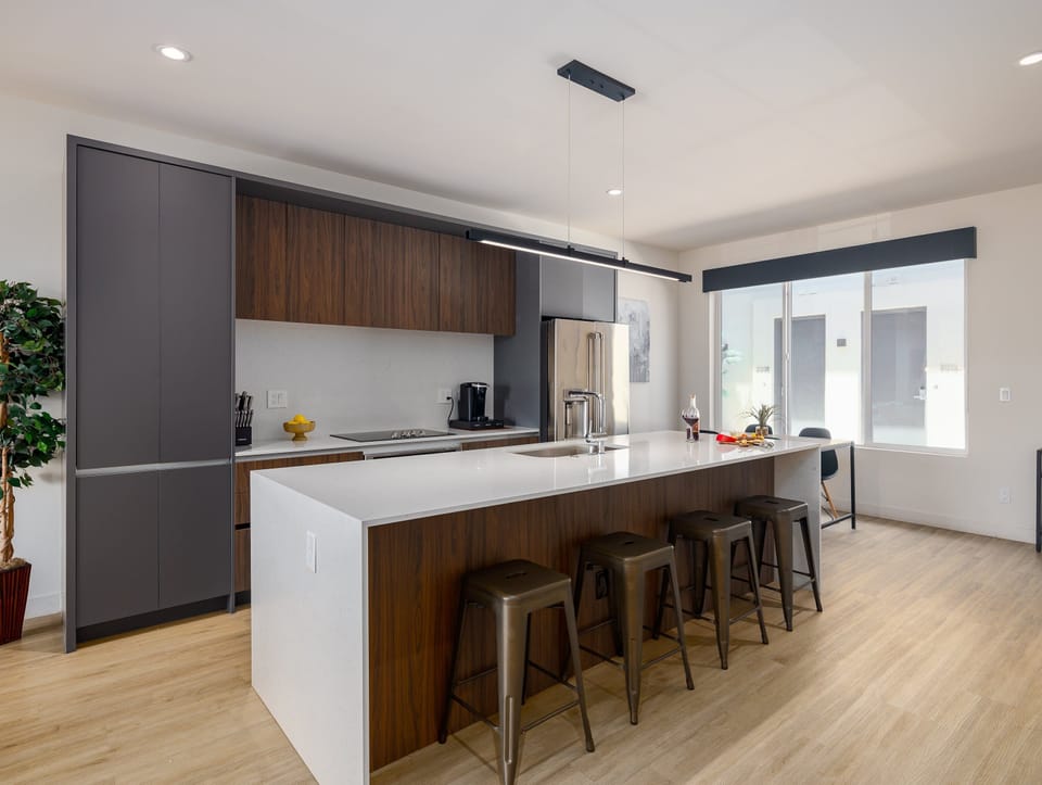 1st Floor: Fully equipped modern kitchen completely stocked with all culinary essentials and includes high-end Cafe stainless steel appliances.