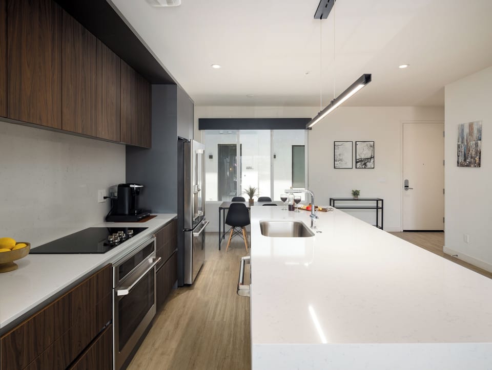 1st Floor: Fully equipped modern kitchen completely stocked with all culinary essentials and includes high-end Cafe stainless steel appliances.
