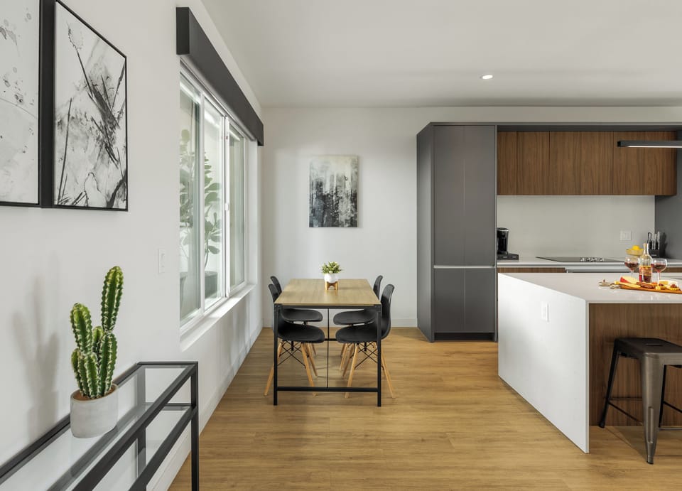1st Floor: Fully equipped modern kitchen completely stocked with all culinary essentials and includes high-end Cafe stainless steel appliances. Dining table offers a space for four.