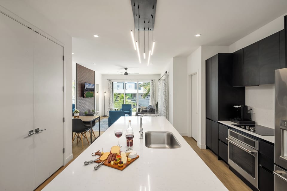 1st Floor: Fully equipped modern kitchen completely stocked with all culinary essentials and includes high-end Cafe stainless steel appliances.