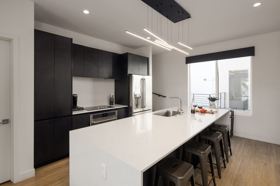 1st Floor: Fully equipped modern kitchen completely stocked with all culinary essentials and includes high-end Cafe stainless steel appliances.