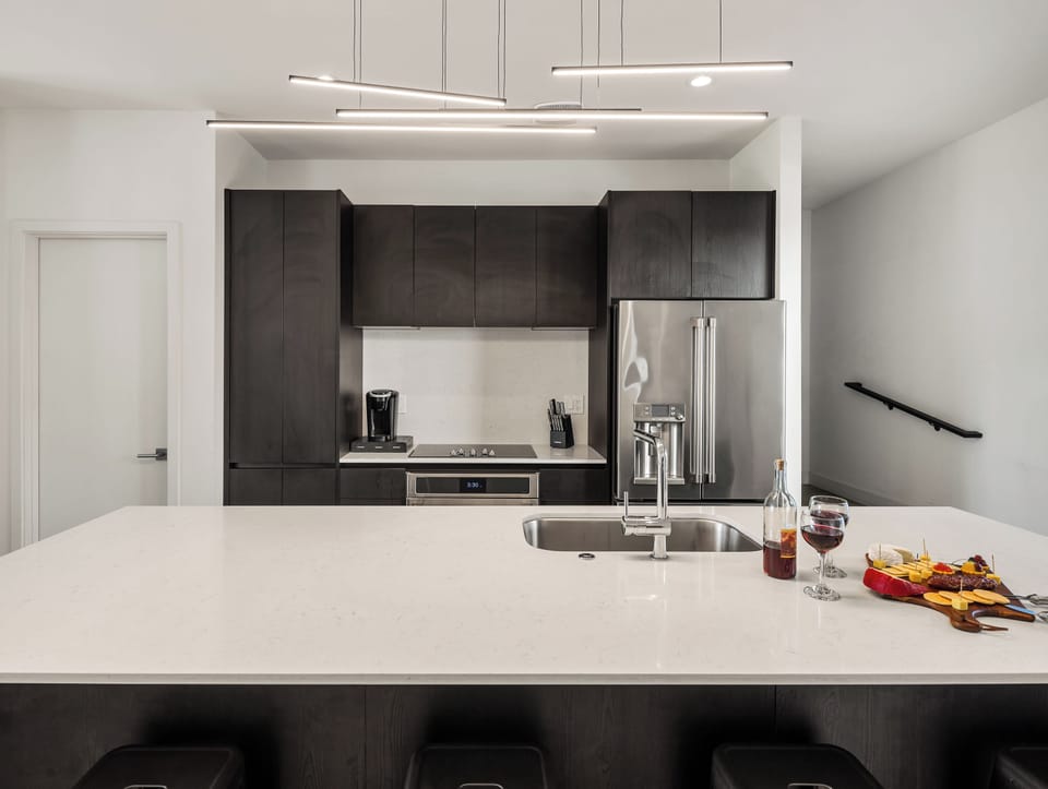 1st Floor: Fully equipped modern kitchen completely stocked with all culinary essentials and includes high-end Cafe stainless steel appliances.