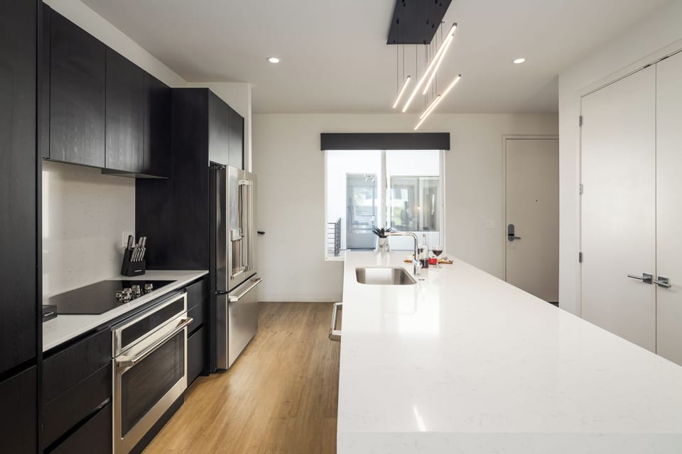 1st Floor: Fully equipped modern kitchen completely stocked with all culinary essentials and includes high-end Cafe stainless steel appliances.