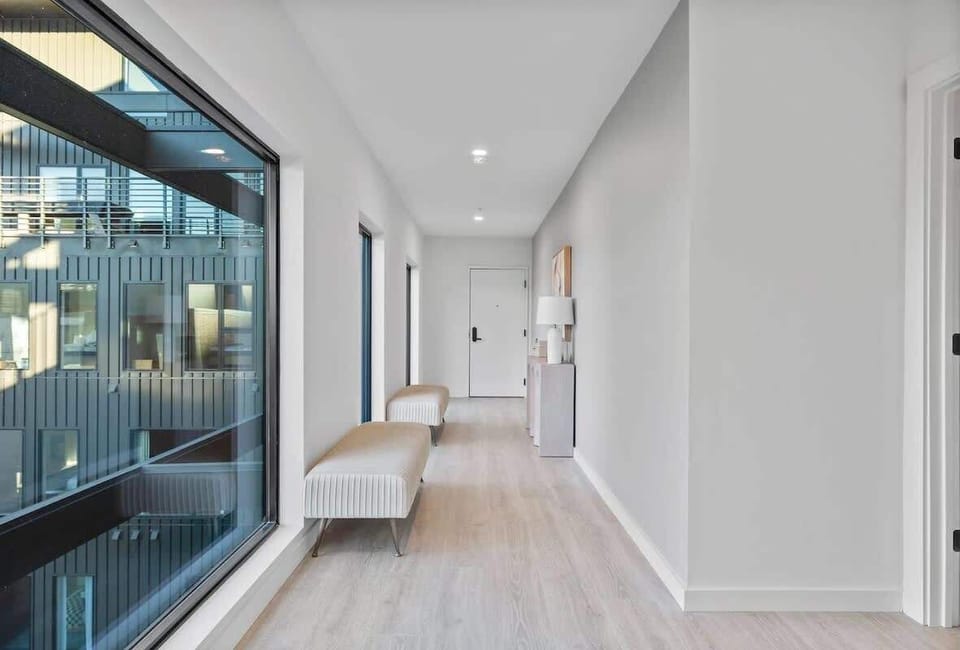 Unit 1: Bright and spacious entry way leading to the living area.