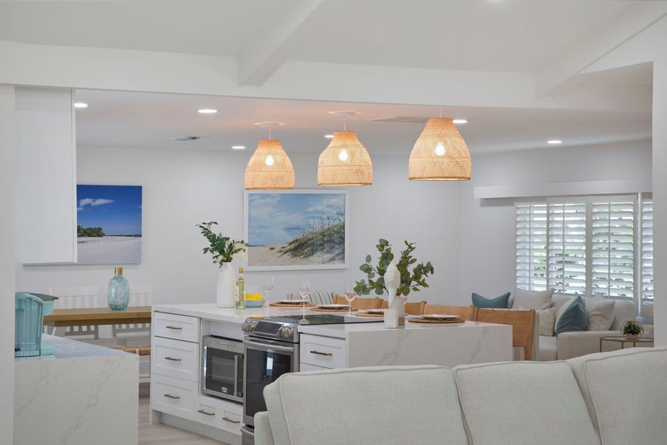 Fully equipped kitchen with breakfast bar and seating for four guests
