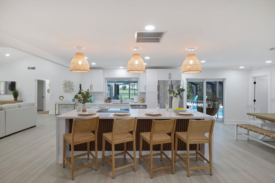 Fully equipped kitchen with breakfast bar and seating for four guests