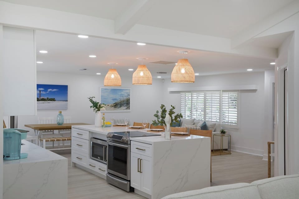 Fully equipped kitchen with breakfast bar and seating for four guests