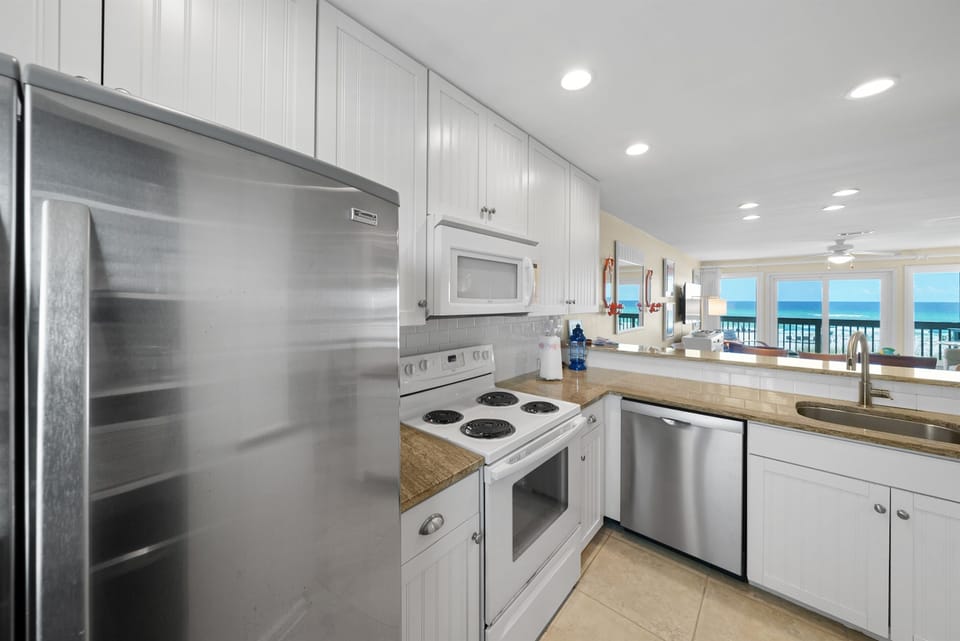 Cook with stunning ocean views in your fully equipped kitchen, featuring stainless steel appliances and everything you need for memorable meals.