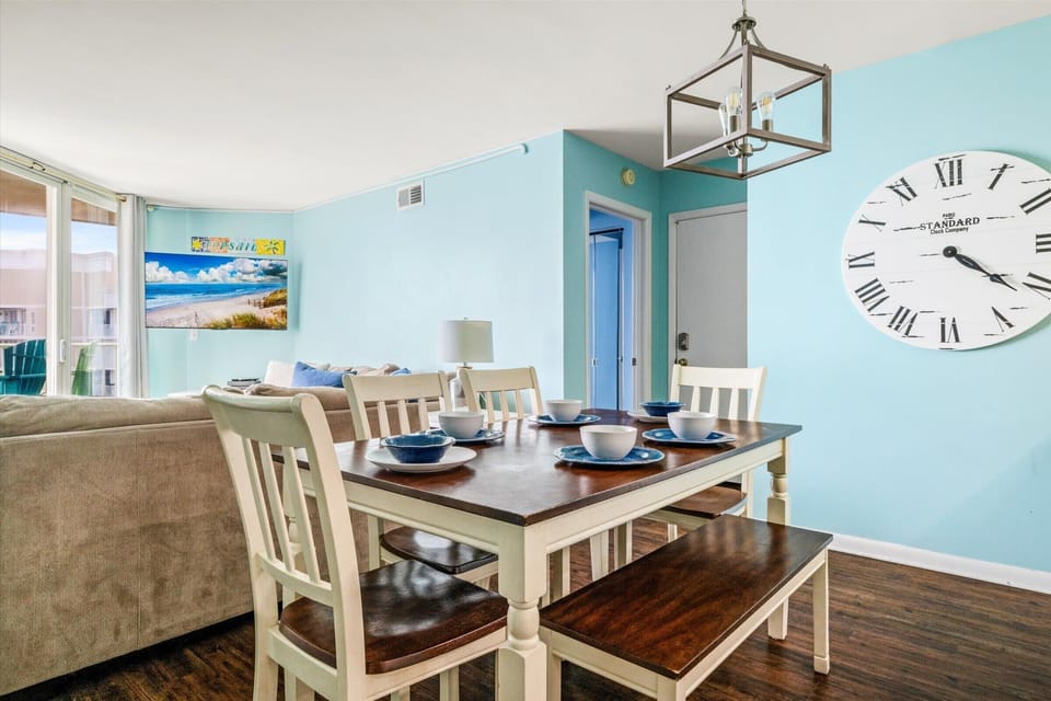 Gather around the dining table with natural light and ocean energy pouring in.