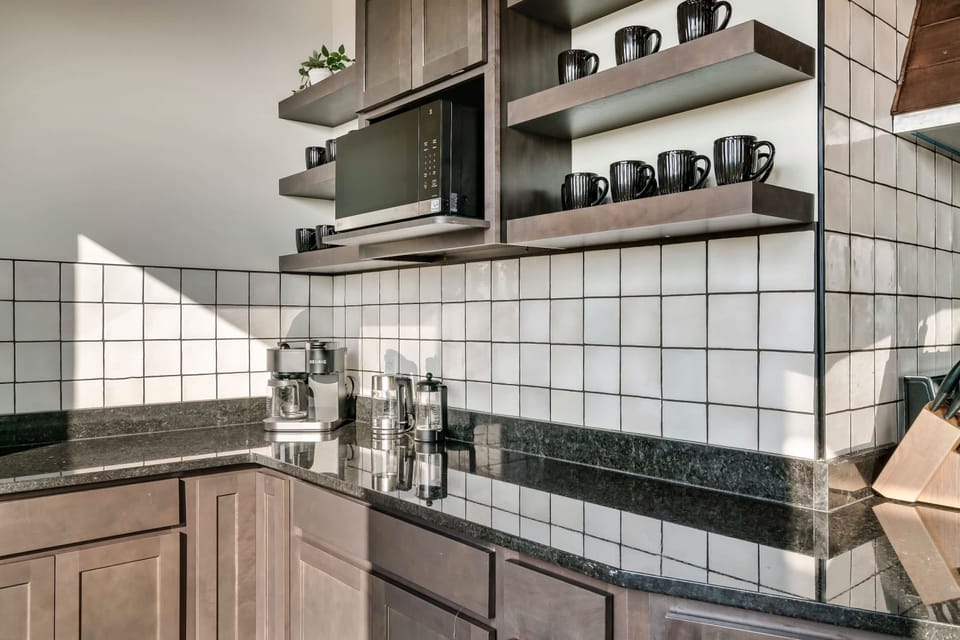 Sleek granite counters and stylish shelves make for a chef’s paradise in Sevierville!