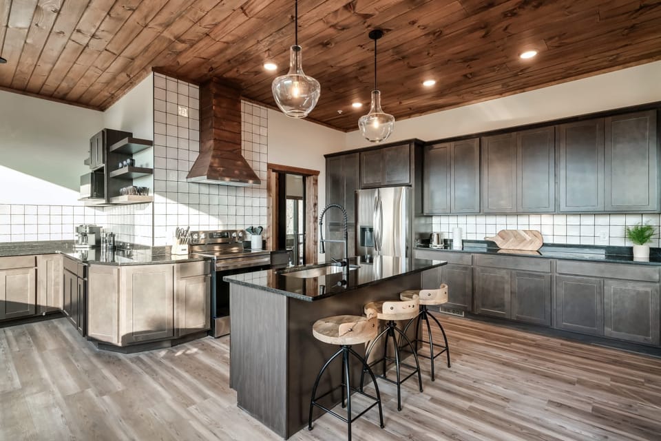 Whip up your favorite dishes while soaking in the charm of this Sevierville cabin kitchen.