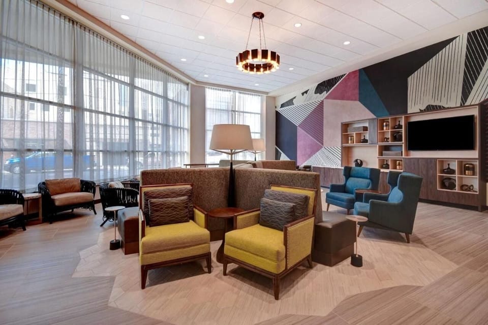 Settle into the vibrant lounge for relaxed conversation and coffee.