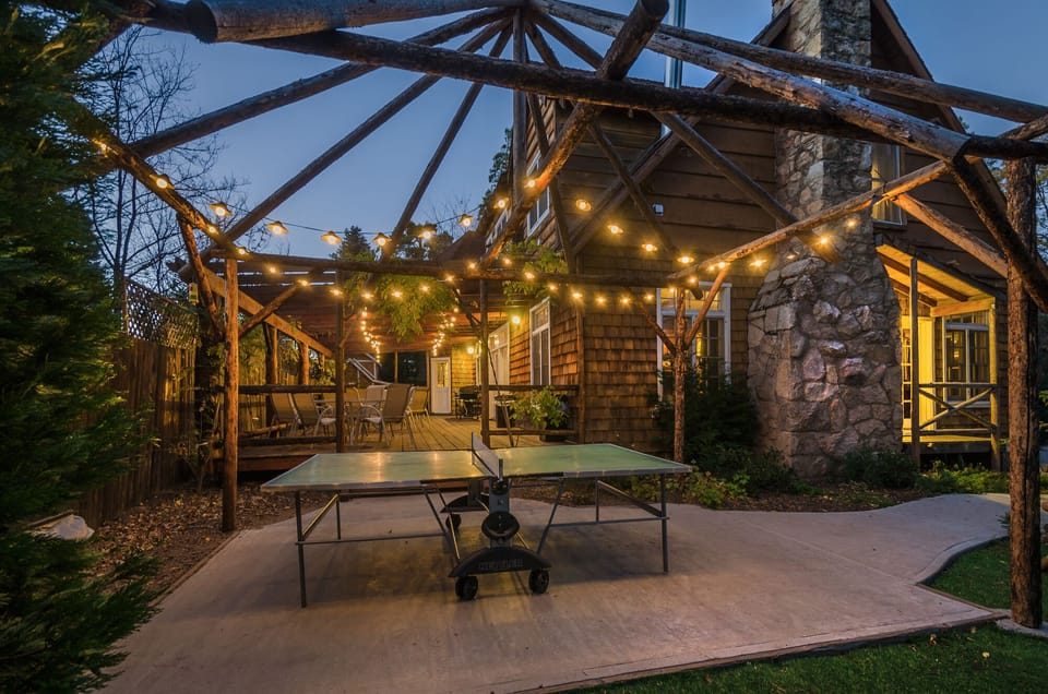 Backyard with ping pong table at night