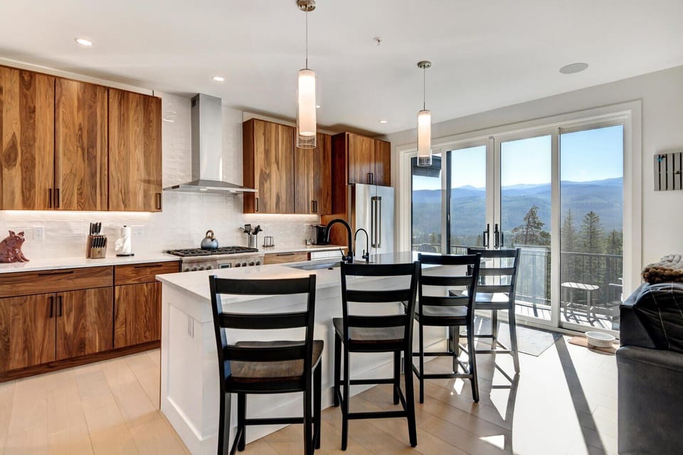 Fully Stocked Chefs Kitchen With An Oversized Island That Includes Bar Seating For 4 People
