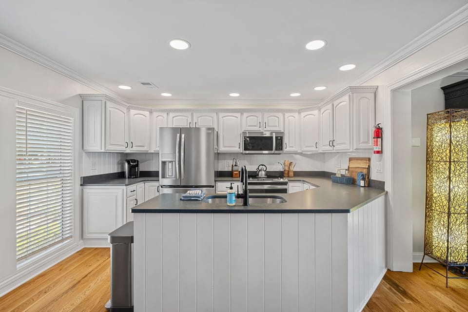 Fully stocked kitchen with large island to prep all your group meals.,