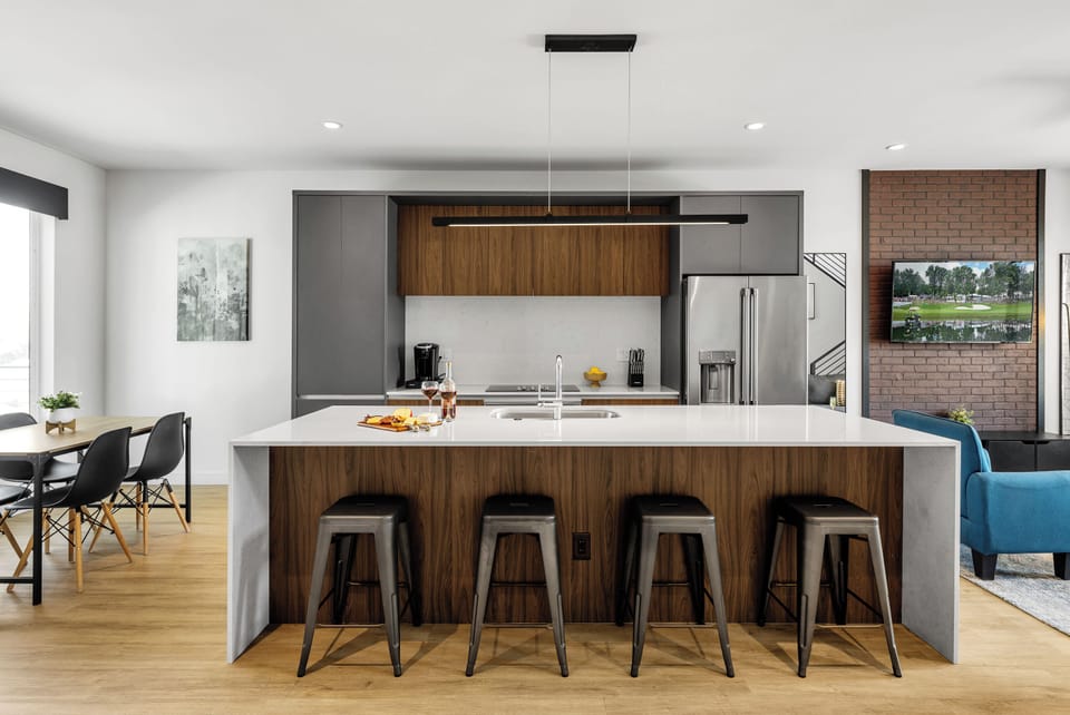 Unit 1 (1st Floor): Fully equipped modern kitchen completely stocked with all culinary essentials and includes high-end Cafe stainless steel appliances. Dining table offers a space for four.
