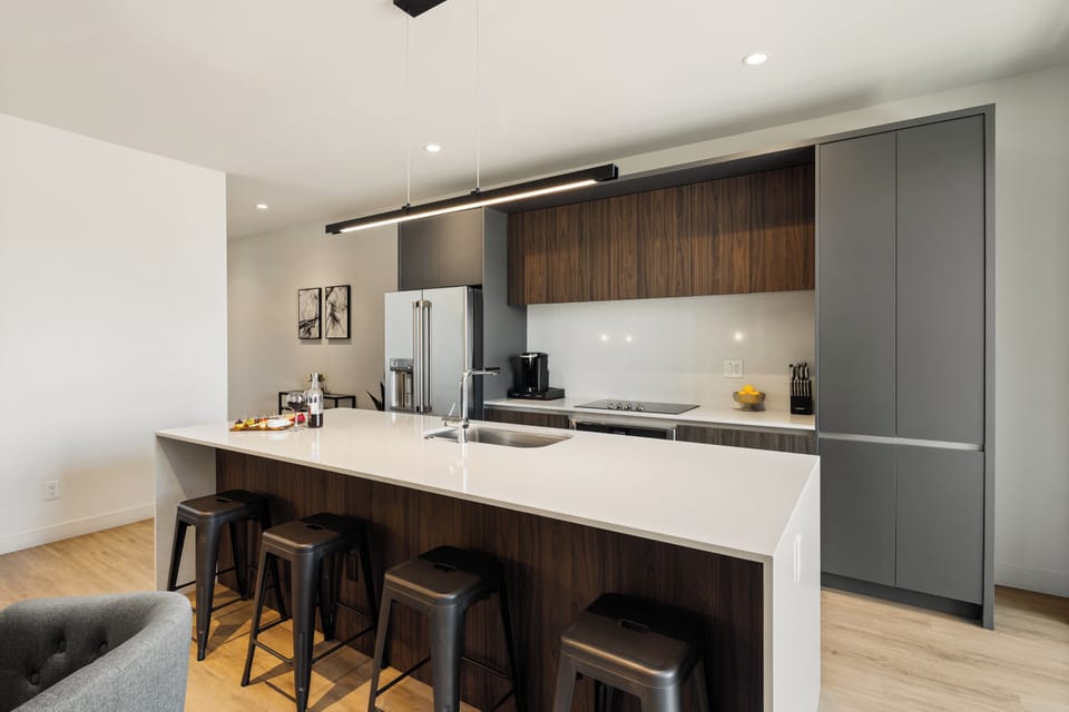 Unit 1 - 1st Floor: Fully equipped modern kitchen completely stocked with all culinary essentials and includes high-end Cafe stainless steel appliances.