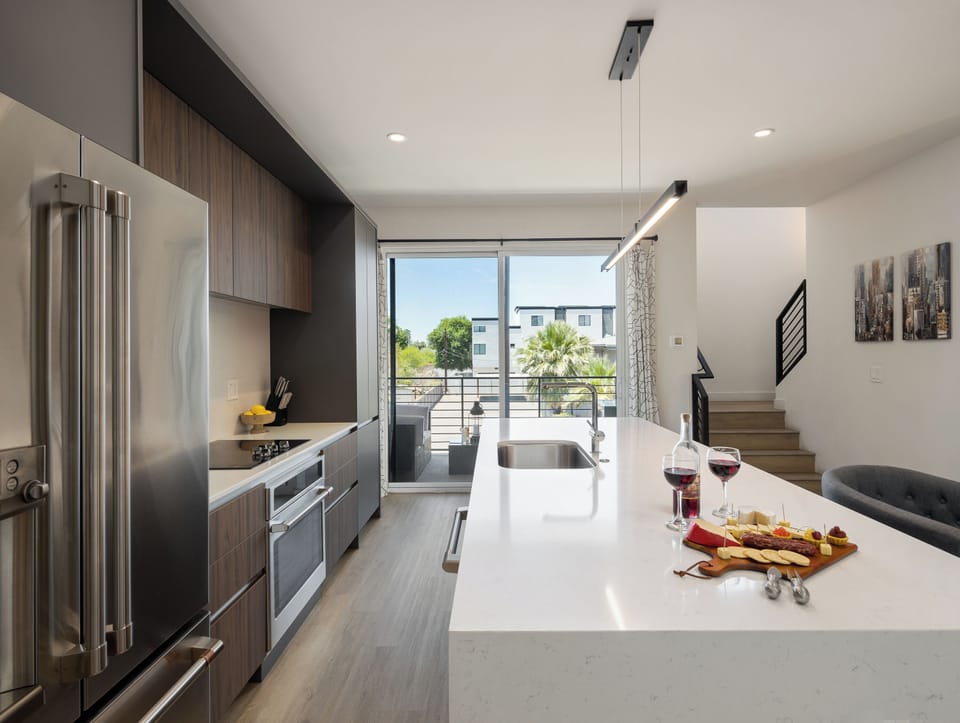 Unit 1 - 1st Floor: Fully equipped modern kitchen completely stocked with all culinary essentials and includes high-end Cafe stainless steel appliances.