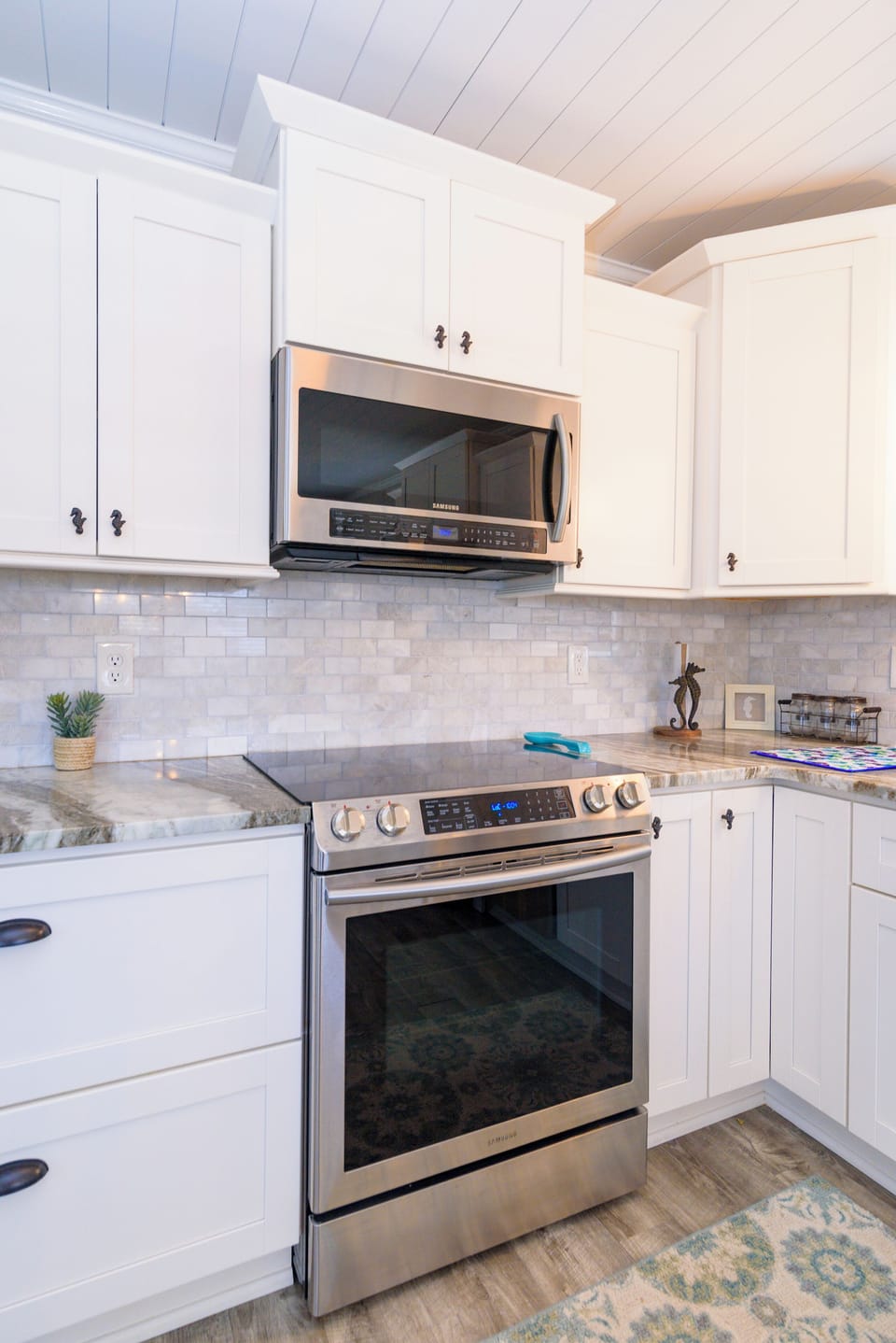 kitchen - This kitchen is modern and marvelous it's stainless-steel appliances and back splash make this a beautiful place to entertain after a long beach day.