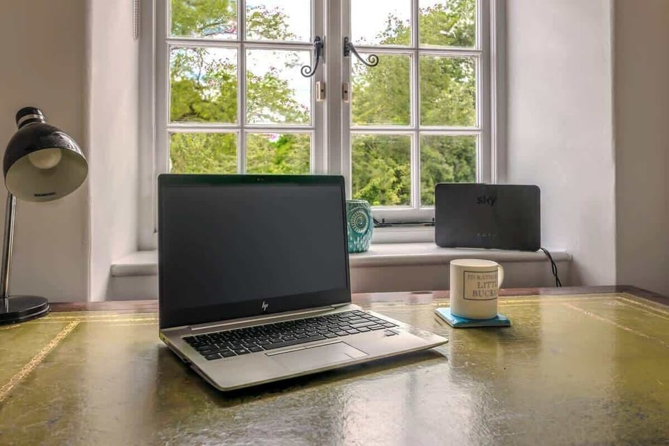 Working from home on holiday - no problem - with a beautiful view of the garden in this dedicated work space!