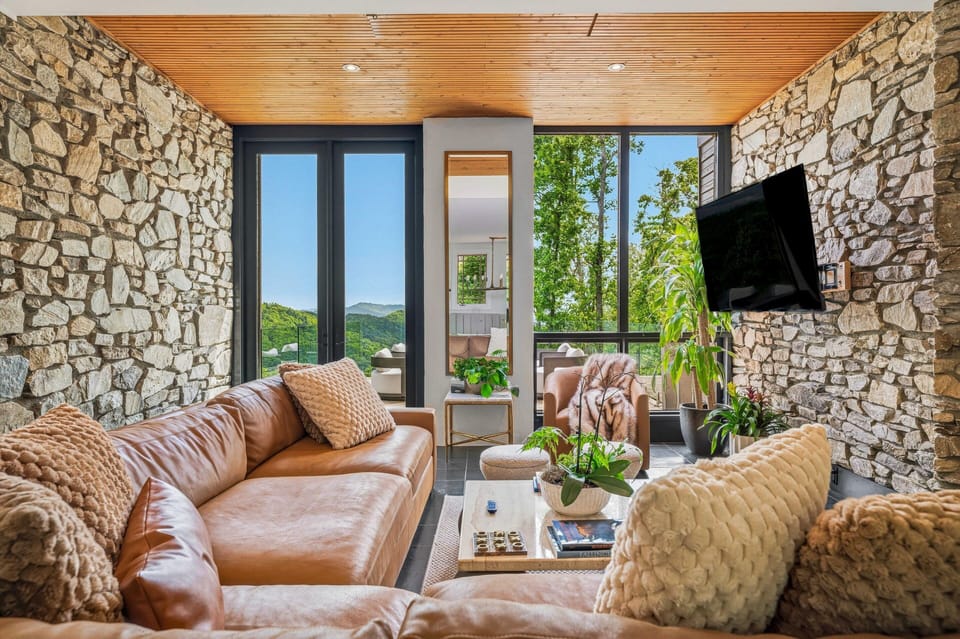 Lounge in the stylish den while you take in views by the fireplace