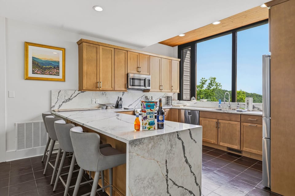 Have a drink and snack at the kitchen counter bar, looking out onto incredible 20-mile views