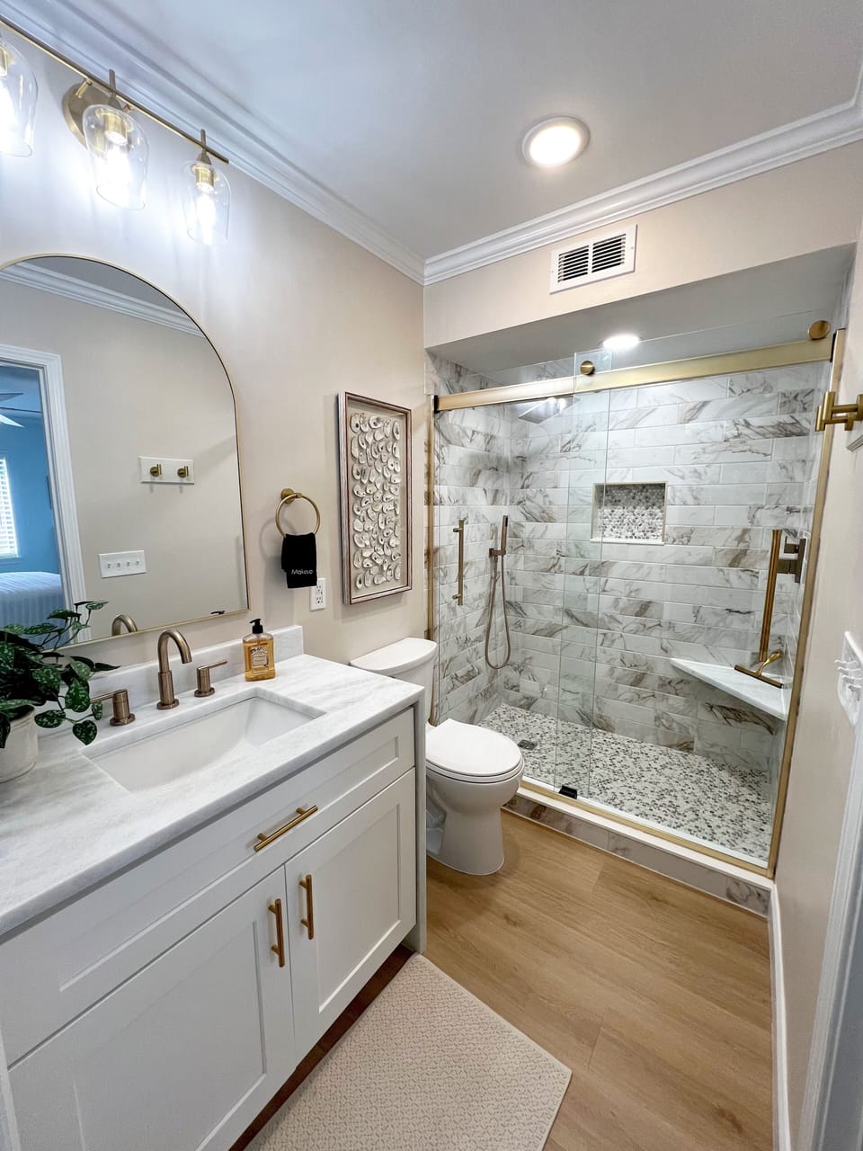 Primary bathroom glass shower for a quick rinse after a day on the sand.