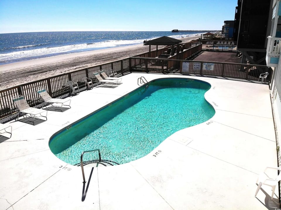 Pool on the beach with loungers, so you get a swim and the ocean view together.