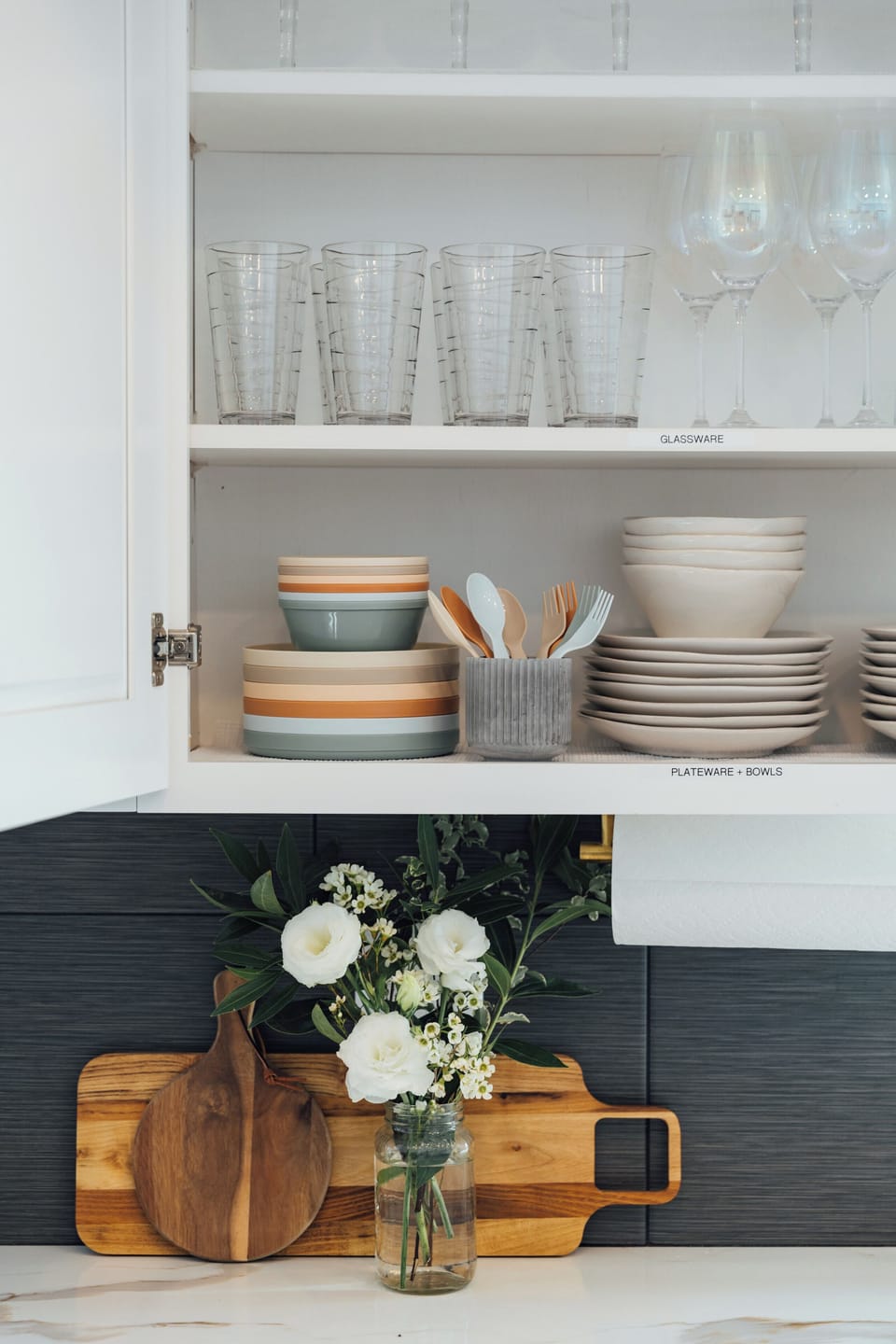 This cabinet holds stoneware and glasses for indoor dining, as well as kids’ dinnerware. Shatter proof drink/dinnerware is also provided for use around the pool.