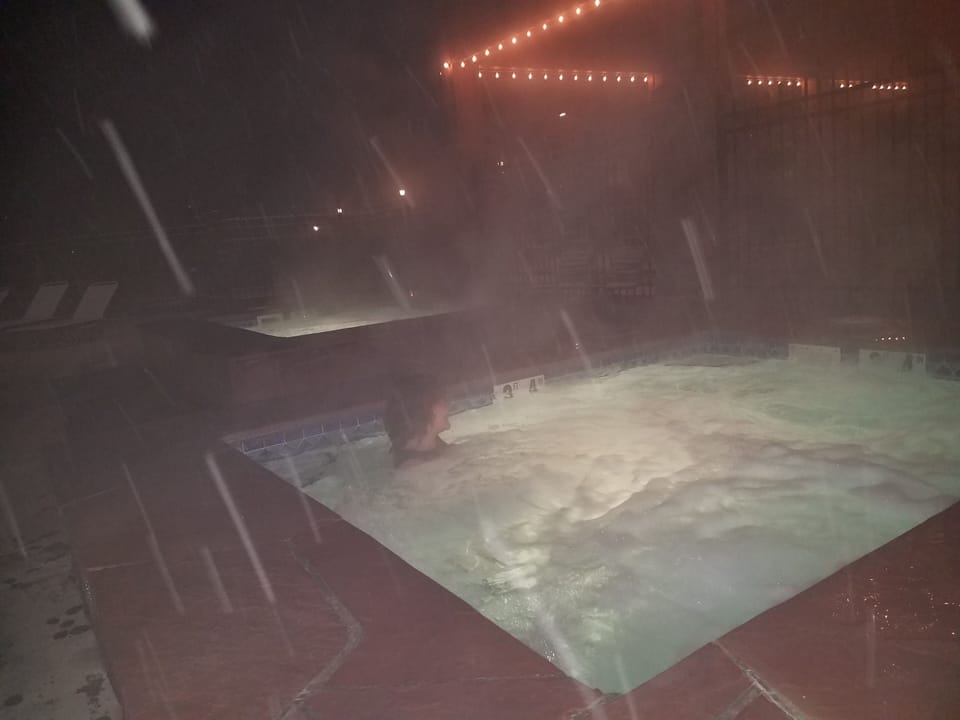 Hot tub in a snowstorm, who needs an icebath when this is available, and warm