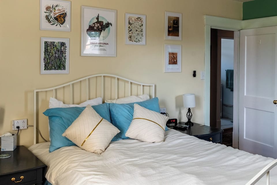Bedside tables with multi-plug and USB ports on each side of the bed.
