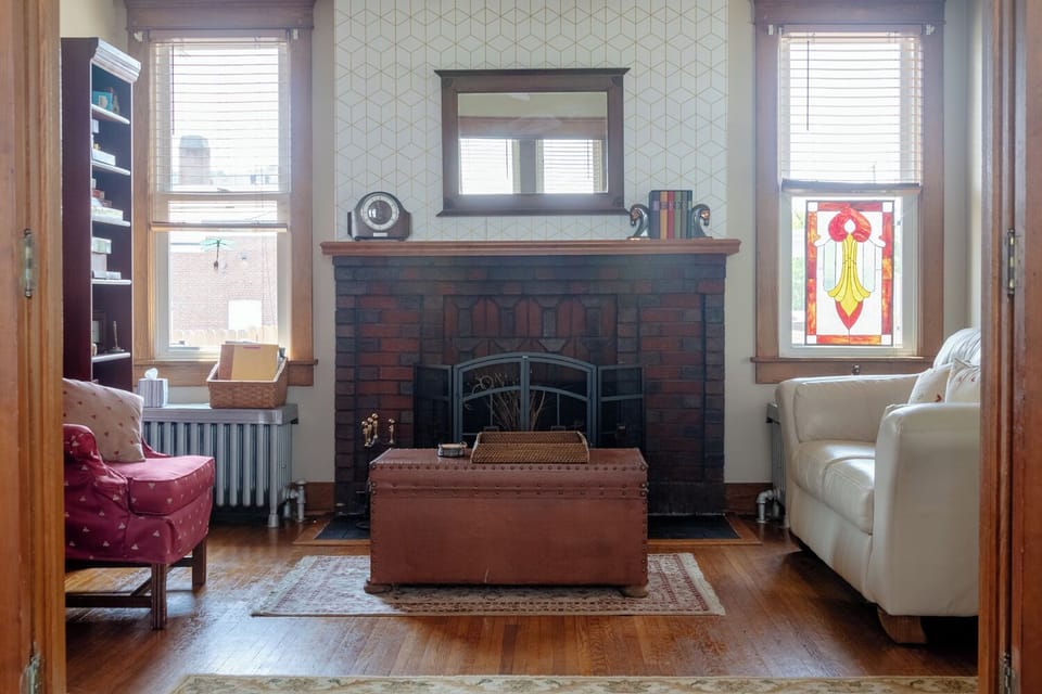 Elegant fire place (not functional) and games cabinet in the Game Room.
