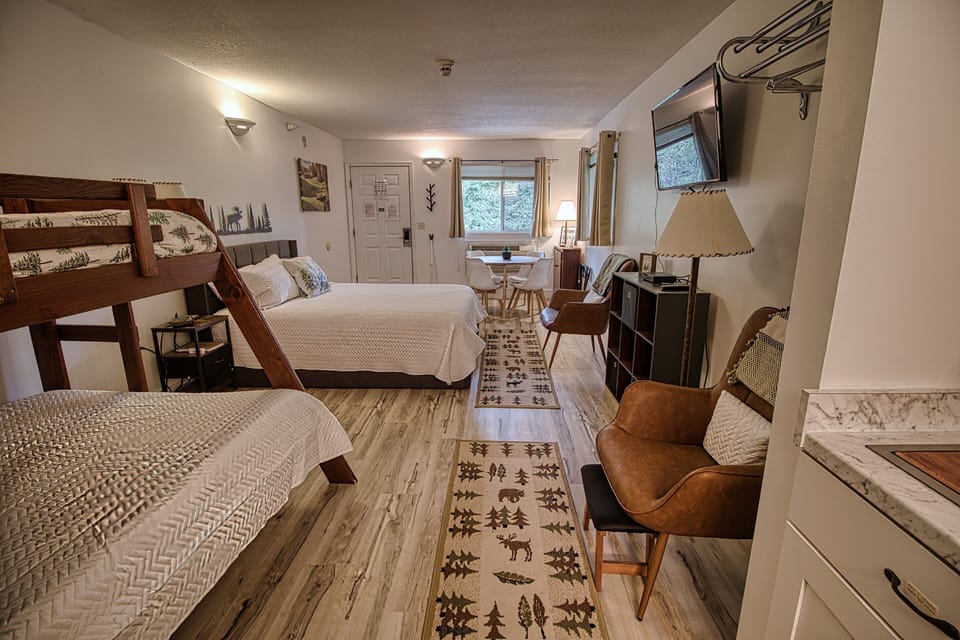 Room now has an updated TV and fireplace wall. 