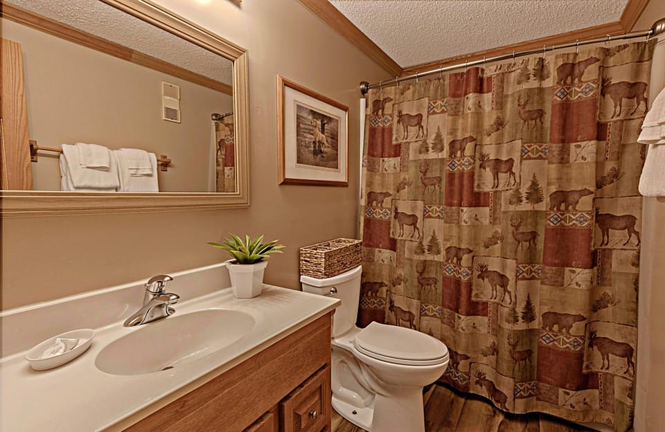 The modern bathroom is located in the hall.
