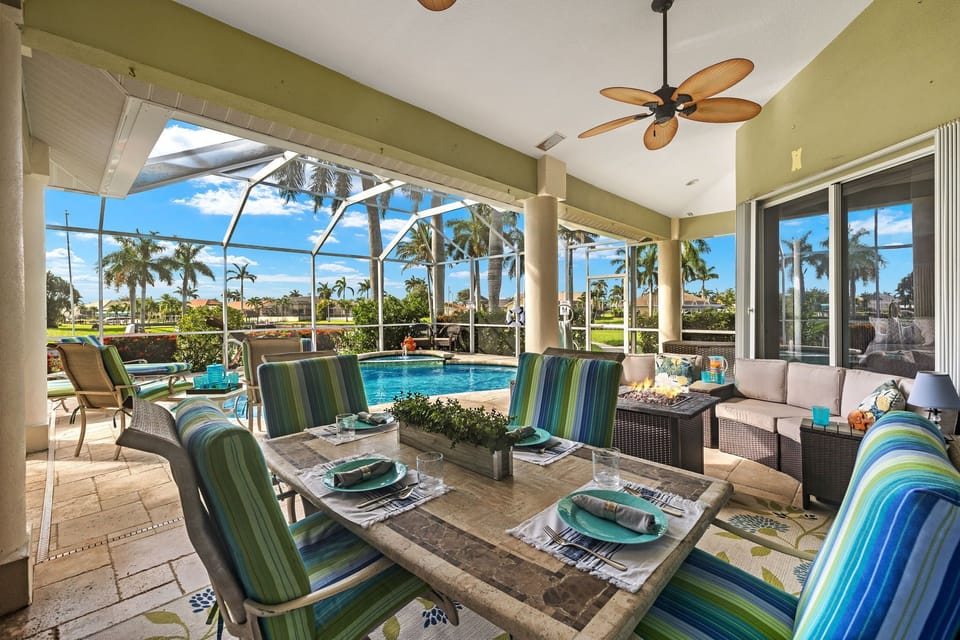 Enjoy meals poolside with the dining area!