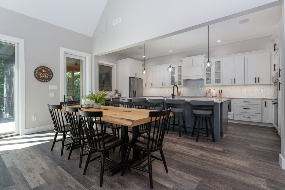 Island seating for 4 and open-concept dining area for 8