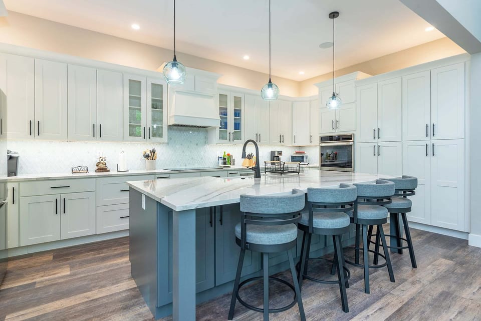 Deluxe chef's kitchen with high-end appliances, double oven, dishwasher, wine cooler, and Drip-style coffeemaker