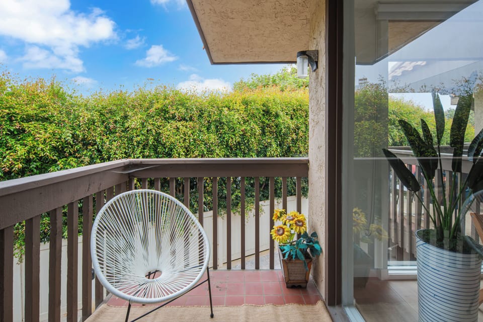 Guest bedroom: king bed, desk & chair for remote working, small private balcony, smart TV, walk-in closet