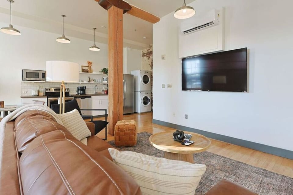 Living Room Retreat: Stylish decor and ample light make this space perfect for relaxation!