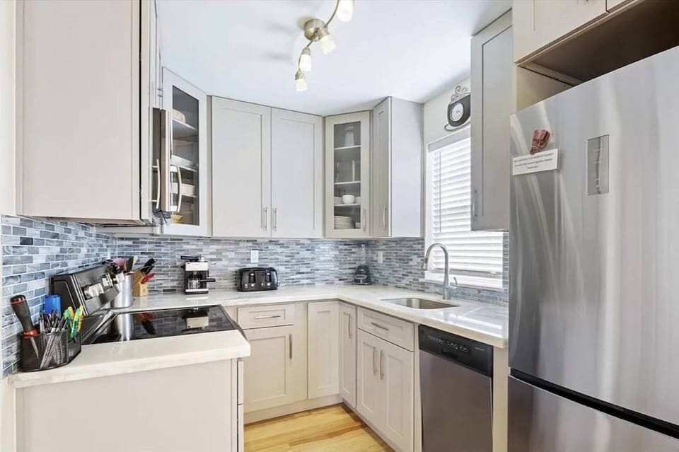 The updated kitchen at Castaway Cove boasts modern appliances and sleek finishes, making meal preparation a delightful and effortless experience.