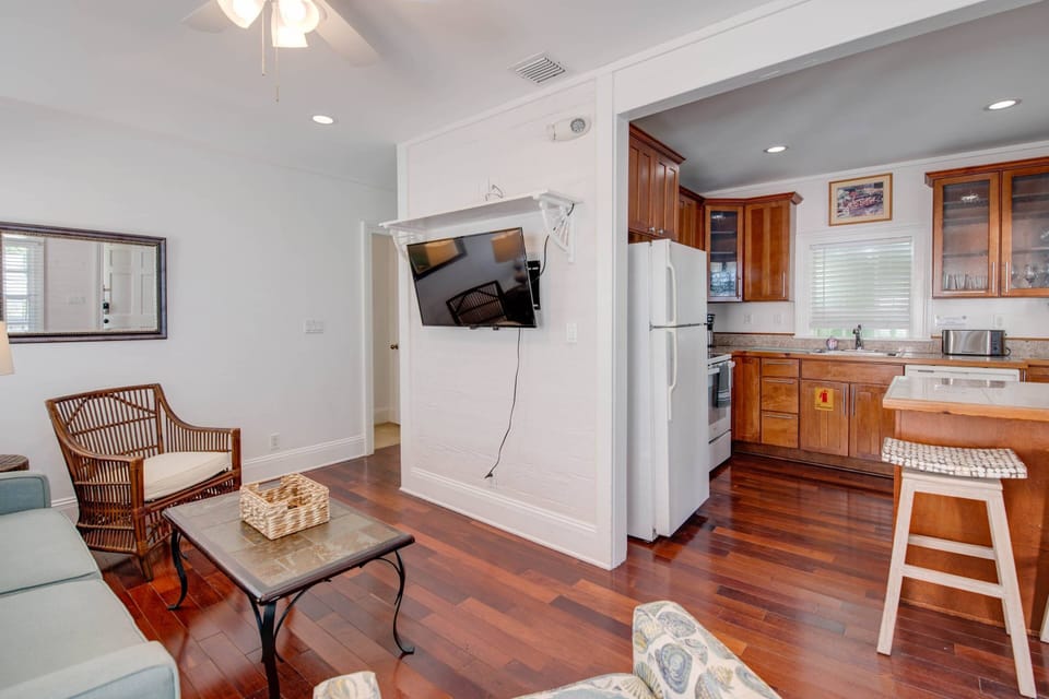 The open floor plan seamlessly connects the living room to the kitchen, creating a spacious and cohesive living area.