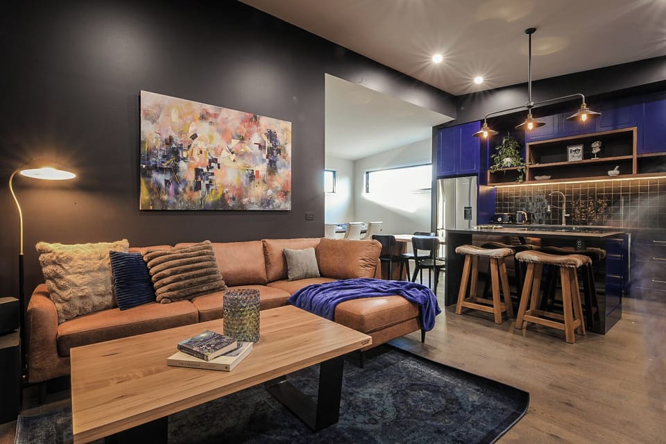 Living room, breakfast bar, kitchen and dining (background)