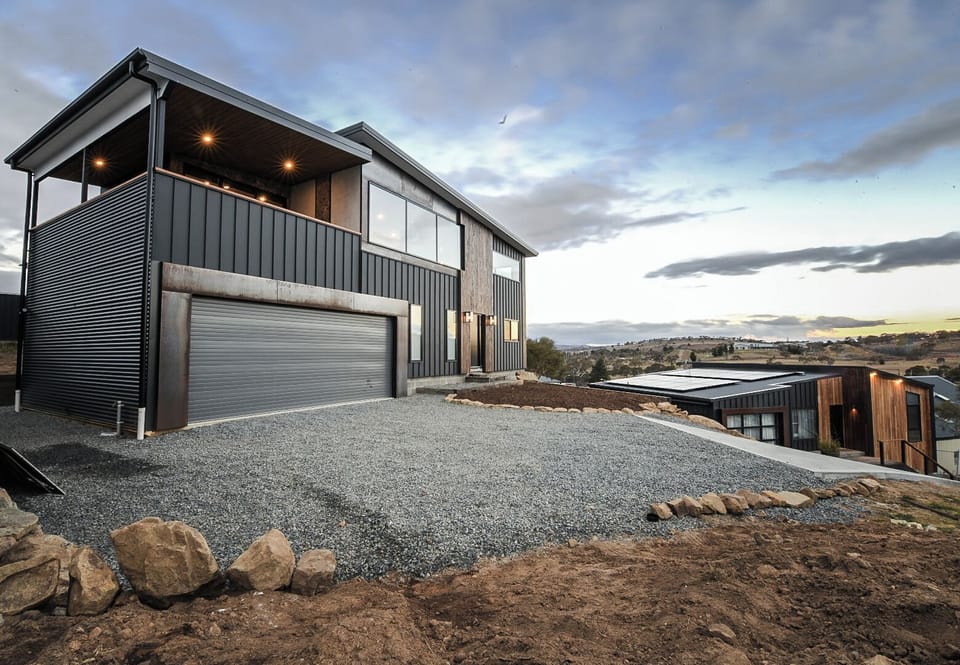 External structure, dual car garage, driveway (concrete + gravel)